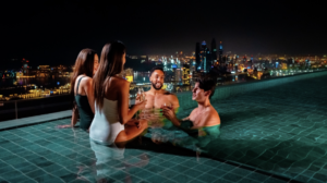Moonlit starlit swimming at the iconic Dubai infinity pool high above the JBR coastline.